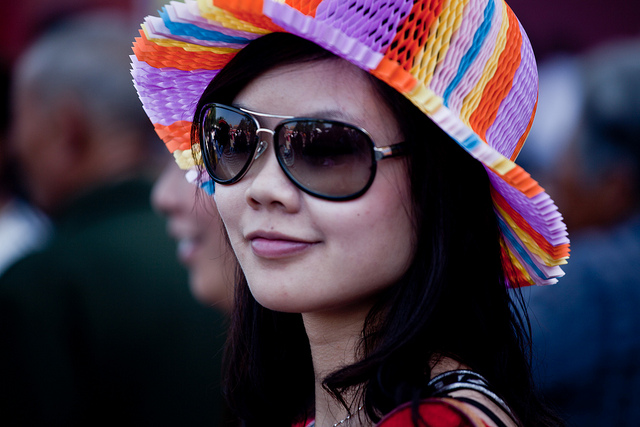 girl with hat. Tianamen square, national holiday, beijing.